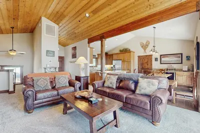 a living room with two couches and a table at Fabian Holidays in Tahoe City
