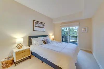 a bedroom with a bed and a window at Central Townhome Less Than 1 Mi to The Village at Mammoth! in Mammoth Lakes