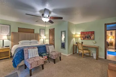 a bedroom with a bed and a ceiling fan at Near Hiking Trails Cabin with Deck in Pioneer! in Pioneer