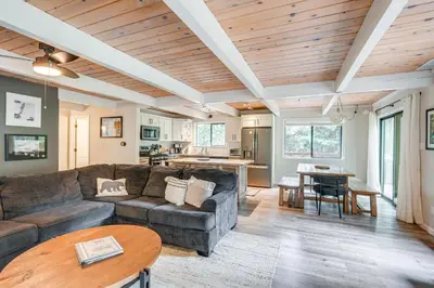 a living room with a couch and a table at Family Cabin in Blue Lake Springs, Near Town! in Arnold