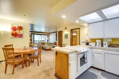 a kitchen and dining room with a table and a dining room at Walk to Ski Shuttle Incline Village Condo in Incline Village
