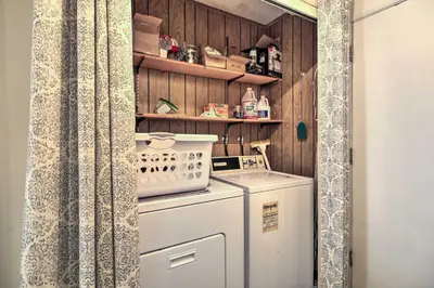 a small laundry room with a washer and dryer at Pinecrest Retreat with Fireplace! in Pinecrest