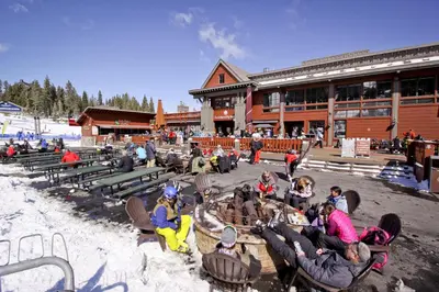 a group of people sitting in chairs in front of a lodge at Aspen Grove Getaway in Kingswood Estates