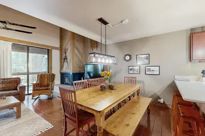 a kitchen with a wooden table and a sink at Aspen Grove Getaway in Kingswood Estates