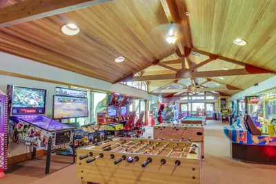 a room with several arcade games and tables at Aspen Grove Getaway in Kingswood Estates