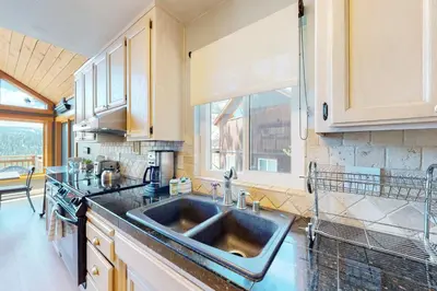 a kitchen with a sink and a window at Ridgeline Panorama in Truckee