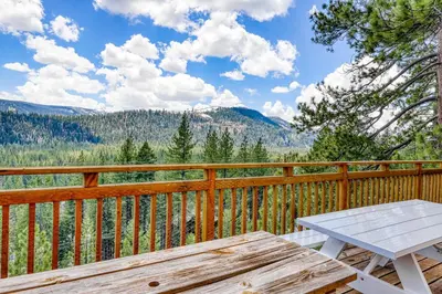 a wooden deck with a picnic table on a wooden fence at Ridgeline Panorama in Truckee
