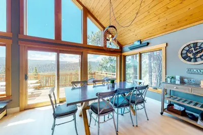 a dining room with a table and chairs at Ridgeline Panorama in Truckee