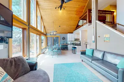 a living room with a couch and a table at Ridgeline Panorama in Truckee