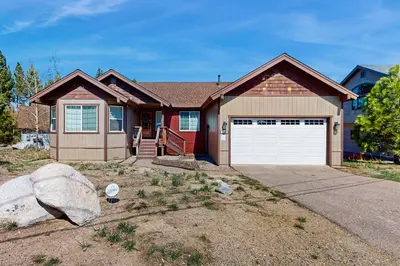 a house with a garage and a rock at Life on Mt Olympia in South Lake Tahoe