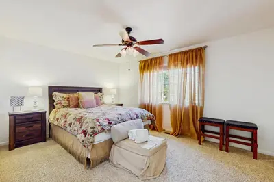 a bedroom with a bed and a ceiling fan at Life on Mt Olympia in South Lake Tahoe