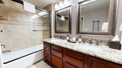 a bathroom with two sinks and a shower at Silver Bear #30 condo in Mammoth Lakes