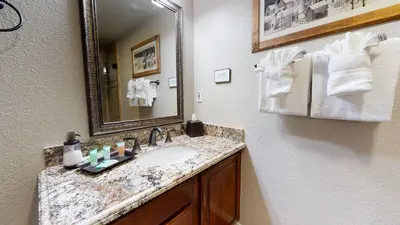 a bathroom with a sink and a mirror at Silver Bear #30 condo in Mammoth Lakes