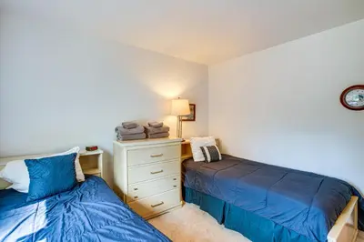 a bedroom with two beds and a dresser at 1 Mi to Heavenly Resort Cozy Home with Deck! in Stateline
