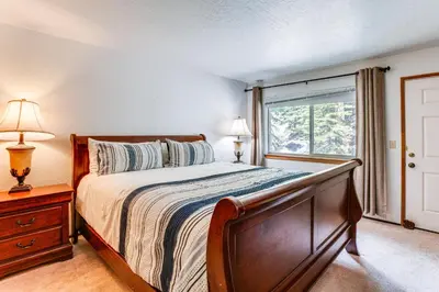 a bedroom with a large bed and a window at 1 Mi to Heavenly Resort Cozy Home with Deck! in Stateline