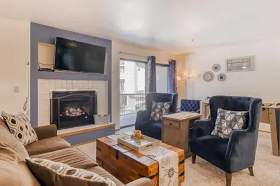 a living room with a couch and a fireplace at South Star Pines Retreat in Stateline