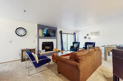 a living room with two couches and a fireplace at South Star Pines Retreat in Stateline