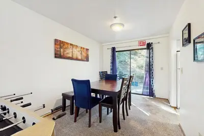 a dining room with a table and chairs at South Star Pines Retreat in Stateline