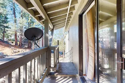 a porch of a house with a fan on it at South Star Pines Retreat in Stateline