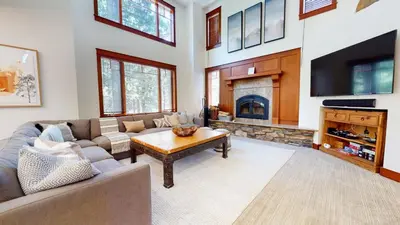 a living room with a couch and a fireplace at Timbers #6 townhouse in Mammoth Lakes