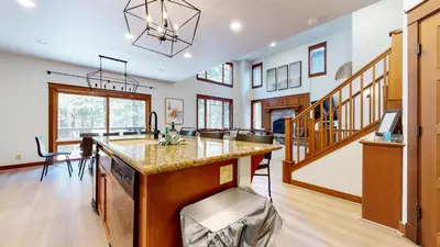 a kitchen with a large island in a house at Timbers #6 townhouse in Mammoth Lakes