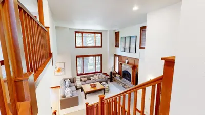 a living room with a couch and a fireplace at Timbers #6 townhouse in Mammoth Lakes