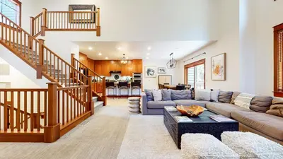 a living room with a couch and a table at Timbers #6 townhouse in Mammoth Lakes