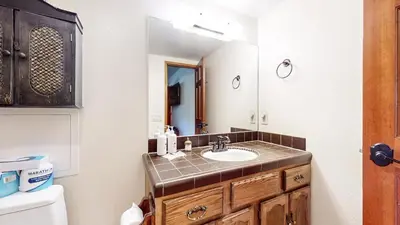 a bathroom with a sink and a mirror at Rainbow Villas #1 condo in Mammoth Lakes