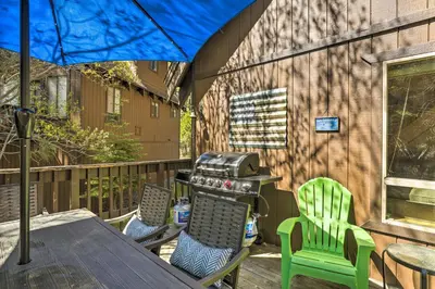 a patio with a table and chairs and a grill at 3 Mi to Lake Tahoe Quiet Incline Village Cabin! in Incline Village