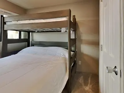 a bedroom with two bunk beds in a room at 1849 Condos 511 condo in Mammoth Lakes