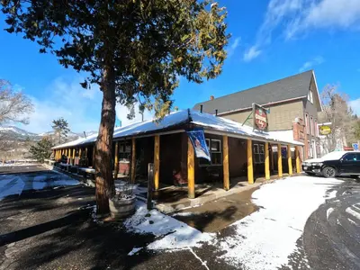 a building with a tree in front of it at CREEKSIDE LODGE in Markleeville