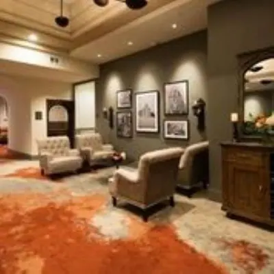 a large living room with couches and a large rug at Gateway Hotel, Trademark Collection by Wyndham in Copper Cove Subdivision