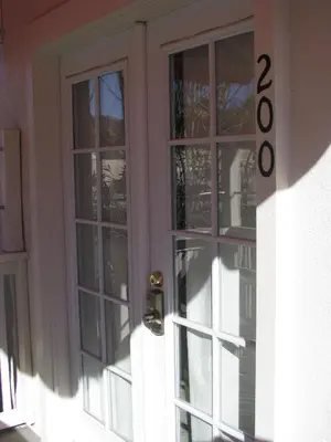 a door with glass windows on a house at 5th Street Inn in Mariposa