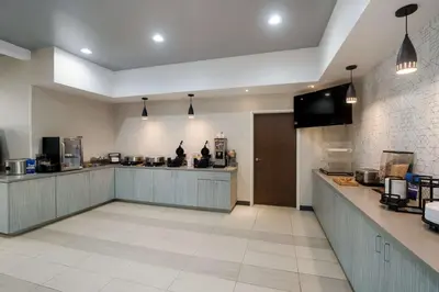 a large kitchen with a counter and a counter top at Best Western Colfax in Colfax