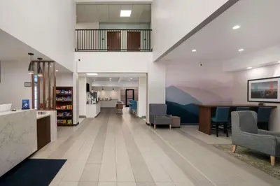 an empty lobby of a hospital with chairs and a desk at Best Western Colfax in Colfax