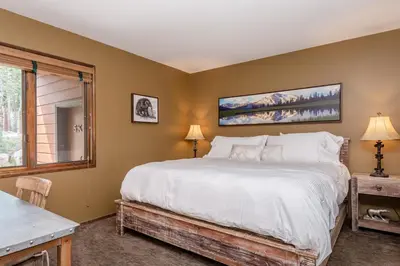 a bedroom with a large bed and a window at Helios 11N in Mammoth Lakes