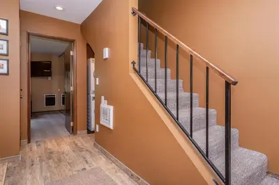 a hallway with a staircase in a house at Helios 11N in Mammoth Lakes