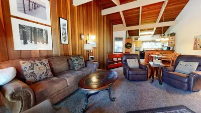 a living room with a couch and a table at 2 Bedroom Condos at Mammoth Estates - Near Mammoth Village! in Mammoth Lakes