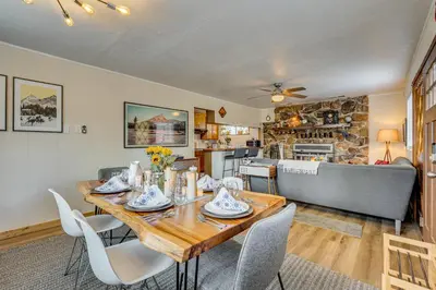 a dining room with a wooden table and chairs at Balcony and Forest Views Cabin in Pioneer! in Pioneer