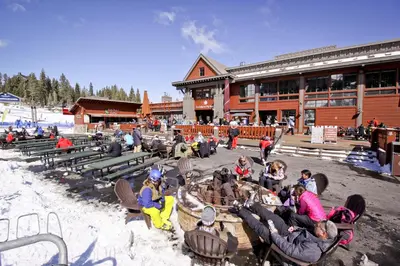 a group of people sitting in chairs in front of a building at Northstar Gold Bend Retreat in Truckee