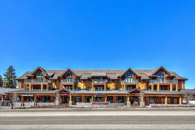 a large wooden house on the side of a road at Luxury Three Bedroom Residence steps from Heavenly Village condo in South Lake Tahoe