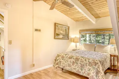a bedroom with a bed and a window at Echo Escape in South Lake Tahoe