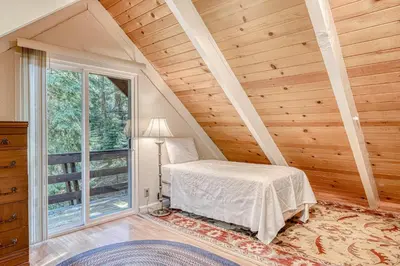 a bedroom with a bed and a large window at Echo Escape in South Lake Tahoe