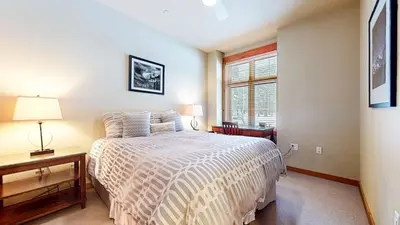 a bedroom with a bed and a window at Solstice #18 condo in Mammoth Lakes