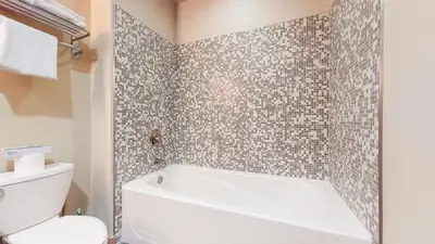 a bathroom with a white tub and a toilet at Solstice #18 condo in Mammoth Lakes