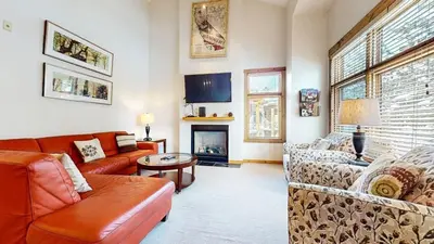 a living room with couches and a fireplace at Solstice #18 condo in Mammoth Lakes
