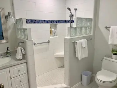 a bathroom with a shower with a toilet and a sink at Villa Alta Vista at Yosemite- Stunning Views and Game Room in Mariposa