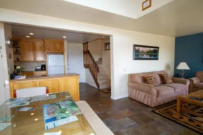 a living room with a couch and a table at Mammoth Ski Racquet Club 55 in Mammoth Lakes