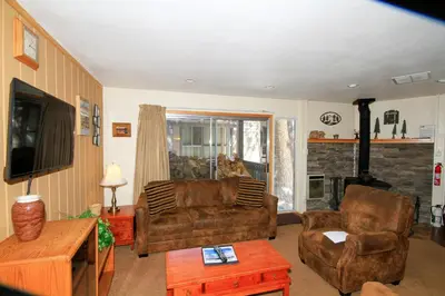 a living room with a couch and a fireplace at Sierra Park Villas 29 in Mammoth Lakes