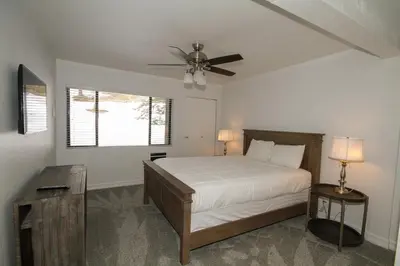 a bedroom with a bed and a ceiling fan at Mammoth Ski Racquet Club 127 in Mammoth Lakes